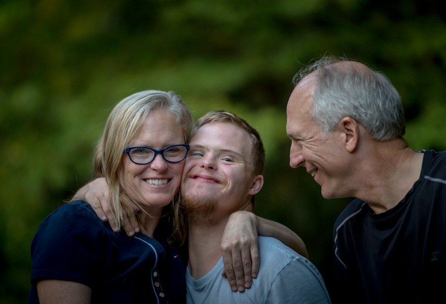 A family hugging and smiling