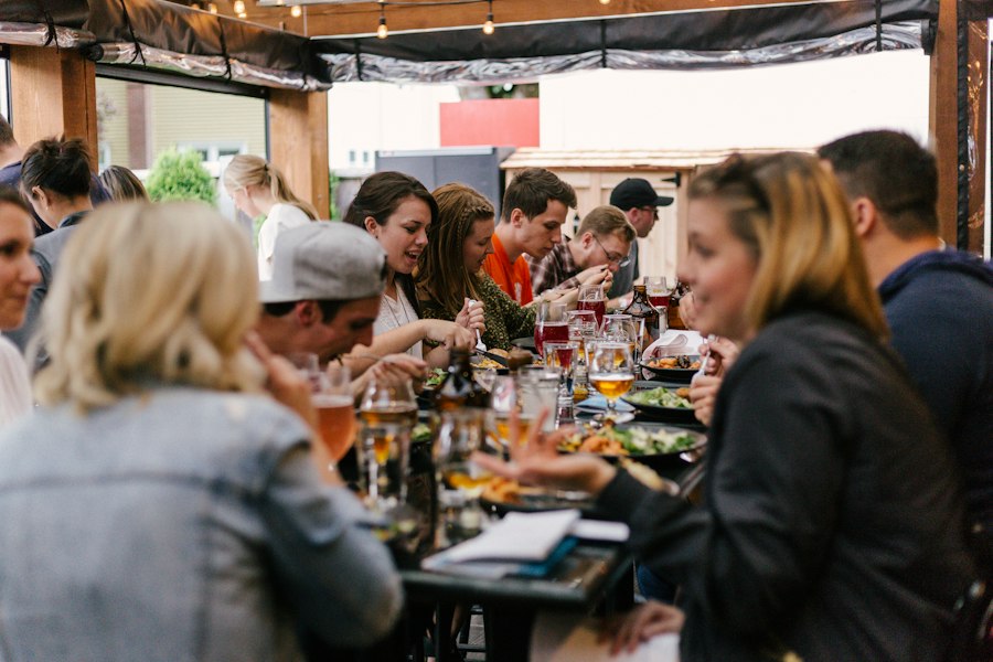 Family and friends at a long dinner table