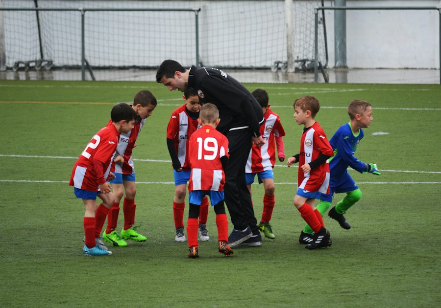 A kids' soccer team with their coach